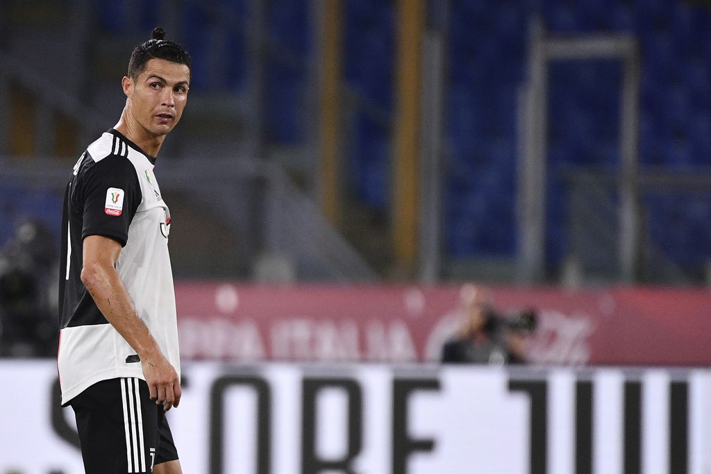 Juventus' Cristiano Ronaldo walks on the pitch during the Italian Cup soccer final between Juventus and Napoli, at the Rome Olympic Stadium, Wednesday, June 17, 2020. (Alfredo Falcone/LaPresse via AP)