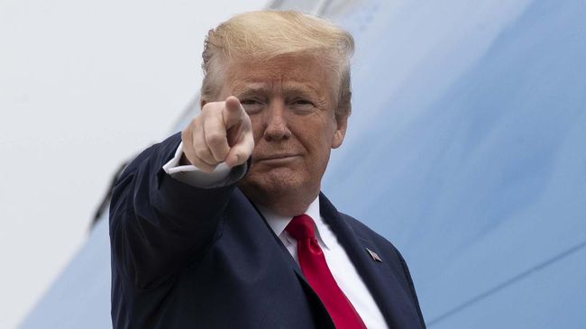 President Donald Trump points while boarding Air Force One as he departs Thursday, May 21, 2020, at Andrews Air Force Base, Md. Trump will visit a Ypsilanti, Mich., Ford plant that has been converted to making personal protection and medical equipment. (AP Photo/Alex Brandon)