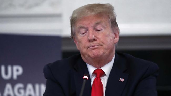 President Donald Trump listens during a roundtable with industry executives about reopening country after the coronavirus closures, in the State Dining Room of the White House, Friday, May 29, 2020, in Washington. (AP Photo/Alex Brandon)