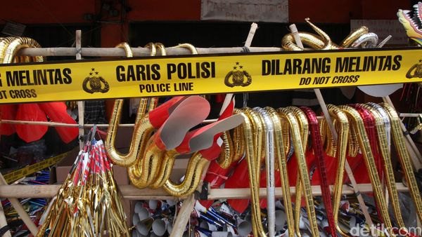 Lokasi Pedagang Terompet Bersampul Alquran Digaris Polisi