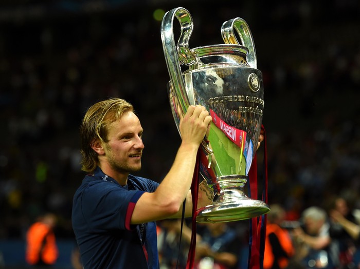 BERLIN, GERMANY - JUNE 06:  Ivan Rakitic of Barcelona holds the trophy as he celebrates victory after the UEFA Champions League Final between Juventus and FC Barcelona at Olympiastadion on June 6, 2015 in Berlin, Germany.  (Photo by Shaun Botterill/Getty Images)