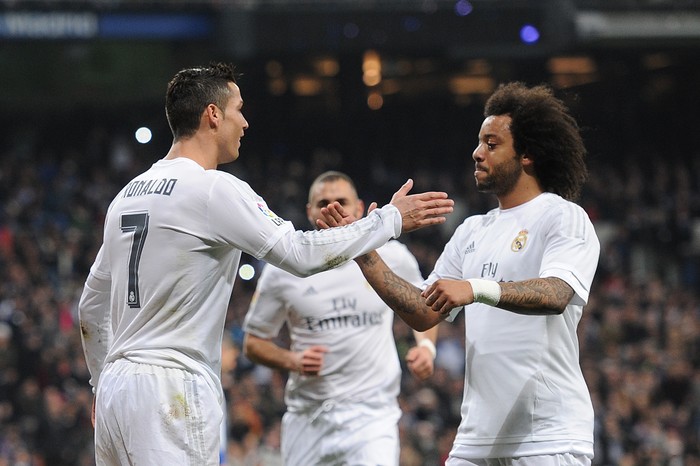 MADRID, SPAIN - JANUARY 31:  Cristiano Ronaldo of Real Madrid celebrates with Marcelo after scoring Reals 2nd goal during the La Liga match between Real Madrid CF and Real CD Espanyol at Estadio Santiago Bernabeu on January 31, 2016 in Madrid, Spain.  (Photo by Denis Doyle/Getty Images)