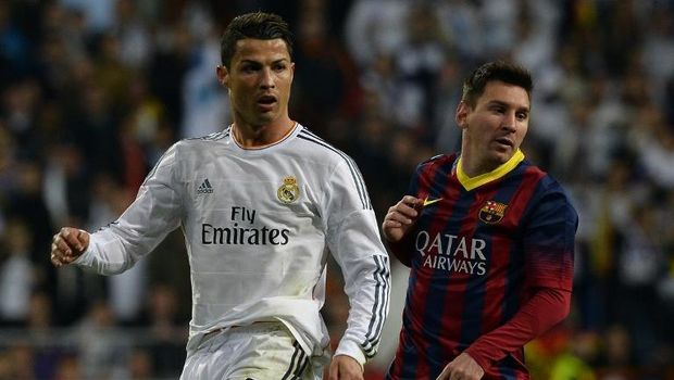 Real Madrid's Portuguese forward Cristiano Ronaldo (L) and Barcelona's Argentinian forward Lionel Messi look on during the Spanish league 