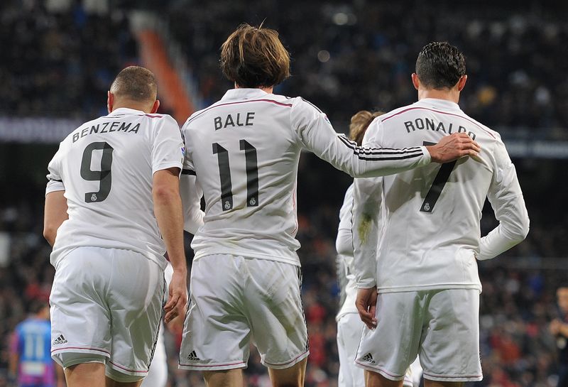   Gareth Bale of Real Madrid celebrates with Cristiano Ronaldo and Karim Benzema  after scoring Real's opening goal during the La Liga match between Real Madrid CF and Levante UD at Estadio Santiago Bernabeu on March 15, 2015 in Madrid, Spain.  (Photo by Denis Doyle/Getty Images)