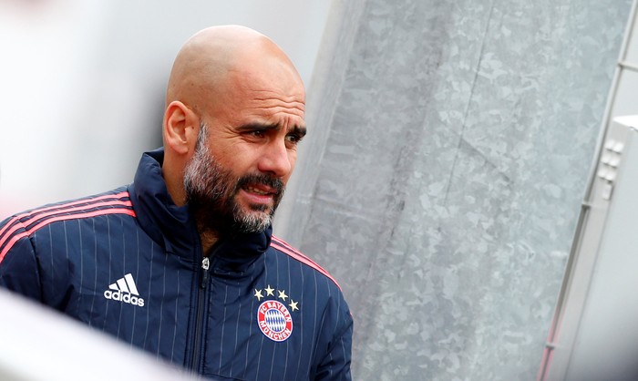 Guardiola Football Soccer - Bayern Munich training - Munich, Germany - 26/04/16. Bayern Munich's coach Pep Guardiola arrives for training prior to UEFA Champions League semi-final match against Atletico Madrid. REUTERS/Michaela Rehle