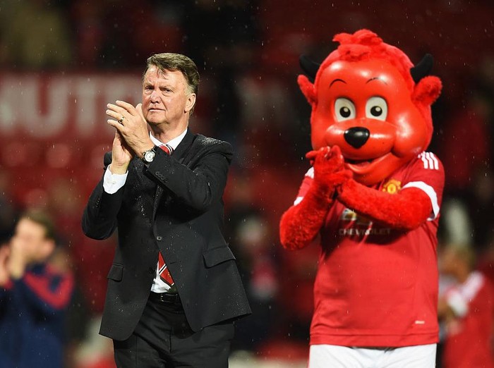 MANCHESTER, ENGLAND - MAY 17:  Louis van Gaal manager of Manchester United applauds the crowd alongside mascot Fred the Red after the Barclays Premier League match between Manchester United and AFC Bournemouth at Old Trafford on May 17, 2016 in Manchester, England.  (Photo by Michael Regan/Getty Images)