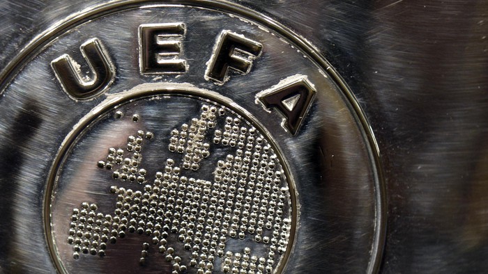 NYON, SWITZERLAND - JULY 18:  The UEFA logo is seen on the UEFA Champions League trophy as it is prepared for the UEFA 2014/15 Champions League third qualifying rounds draw at the UEFA headquarters, The House of European Football, on July 18, 2014 in Nyon, Switzerland.  (Photo by Harold Cunningham/Getty Images for UEFA)