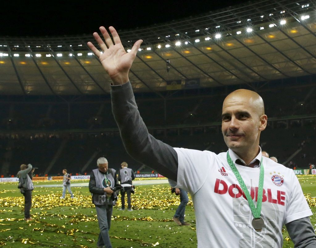 Football Soccer - Bayern Munich v Borussia Dortmund - German Cup (DFB Pokal) Final - Olympiastadion, Berlin, Germany - 21/05/16. Bayern Munich's coach Pep Guardiola celebrates after winning the German Cup final.        REUTERS/Fabrizio Bensch  DFB RULES PROHIBIT USE IN MMS SERVICES VIA HANDHELD DEVICES UNTIL TWO HOURS AFTER A MATCH AND ANY USAGE ON INTERNET OR ONLINE MEDIA SIMULATING VIDEO FOOTAGE DURING THE MATCH.