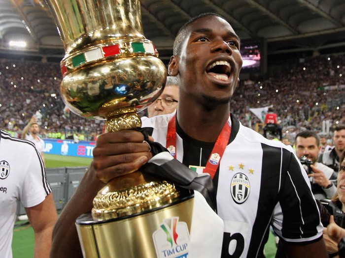 ROME, ITALY - MAY 21: Paul Pogba of Juventus FC celebrates with the trophy after winning the TIM Cup final match against AC Milan at Stadio Olimpico on May 21, 2016 in Rome, Italy.  (Photo by Paolo Bruno/Getty Images)