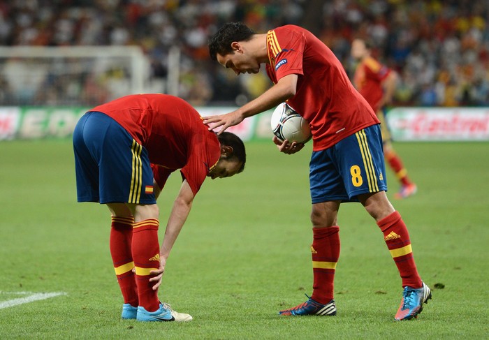 Iniesta-Xavi DONETSK, UKRAINE - JUNE 27: Andres Iniesta and Xavi Hernandez of Spain prepare for penalties during the UEFA EURO 2012 semi final match between Portugal and Spain at Donbass Arena on June 27, 2012 in Donetsk, Ukraine. (Photo by Jasper Juinen/Getty Images)