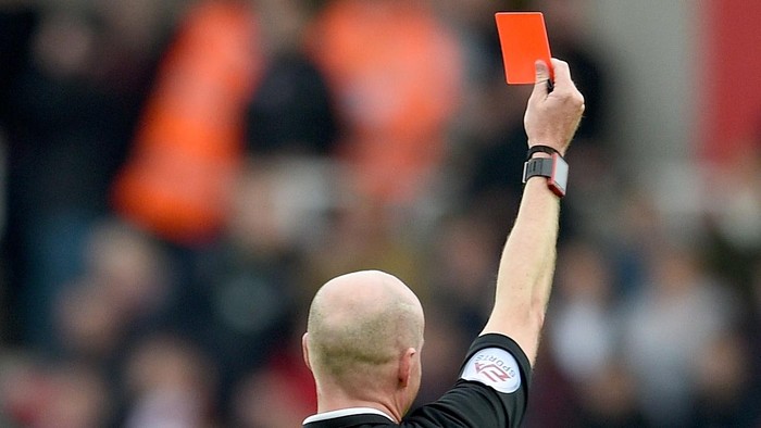 STOKE ON TRENT, ENGLAND - MARCH 12:  A referee shows a red card during the Barclays Premier League match between Stoke City and Southampton at the Britannia Stadium on March 12, 2016 in Stoke on Trent, England.  (Photo by Ross Kinnaird/Getty Images)