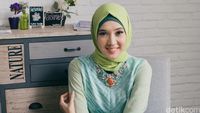 Dhini Aminarti