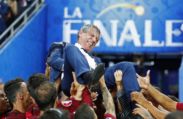 Football Soccer - Portugal v France - EURO 2016 - Final - Stade de France, Saint-Denis near Paris, France - 10/7/16
Portugal head coach Fernando Santos is lifted up by his players after winning Euro 2016 
REUTERS/Kai Pfaffenbach
Livepic