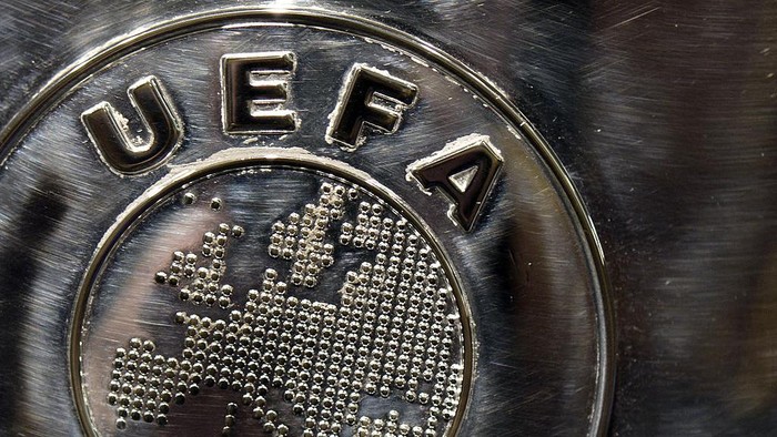 NYON, SWITZERLAND - JULY 18:  The UEFA logo is seen on the UEFA Champions League trophy as it is prepared for the UEFA 2014/15 Champions League third qualifying rounds draw at the UEFA headquarters, The House of European Football, on July 18, 2014 in Nyon, Switzerland.  (Photo by Harold Cunningham/Getty Images for UEFA)