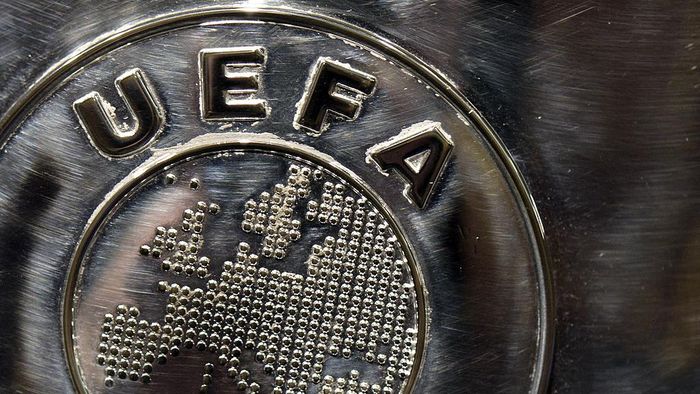 Logo UEFA NYON, SWITZERLAND - JULY 18: The UEFA logo is seen on the UEFA Champions League trophy as it is prepared for the UEFA 2014/15 Champions League third qualifying rounds draw at the UEFA headquarters, The House of European Football, on July 18, 2014 in Nyon, Switzerland. (Photo by Harold Cunningham/Getty Images for UEFA)