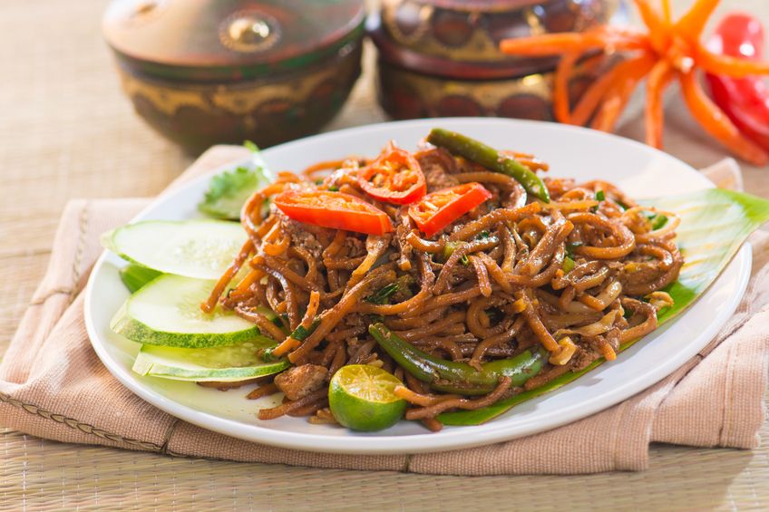 Chinese style fried noodle with fish ball on white isolated background