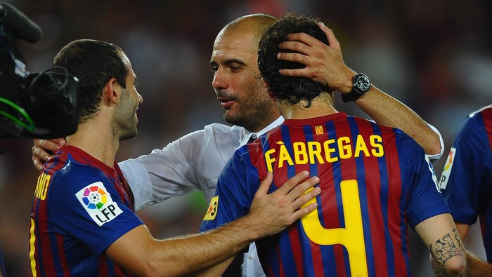 BARCELONA, SPAIN - AUGUST 17: Josep Guardiola  of Barcelona congratulates Cesc Fabregas and Javier Mascherano after victory in the Super Cup second leg match between Barcelona and Real Madrid at Nou Camp on August 17, 2011 in Barcelona, Spain.  (Photo by Laurence Griffiths/Getty Images)