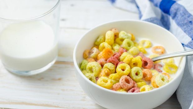 Morning meal, Colorful cereal with milk in white bowl
