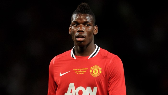 MANCHESTER, ENGLAND - AUGUST 05:  Paul Pogba of Manchester United looks on during Paul Scholes Testimonial Match between Manchester United and New York Cosmos at Old Trafford on August 5, 2011 in Manchester, England.  (Photo by Chris Brunskill/Getty Images)