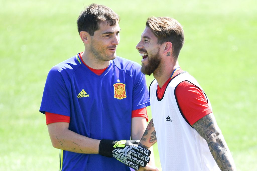 LA ROCHELLE, FRANCE - JUNE 26:  Iker Casillas (L) and Sergio Ramos of Spain share a joke during a training session ahead of their UEFA Euro 2016 round of 16 match against Italy at Complexe Sportif Marcel Gaillard on June 26, 2016 in La Rochelle, France.  (Photo by David Ramos/Getty Images)