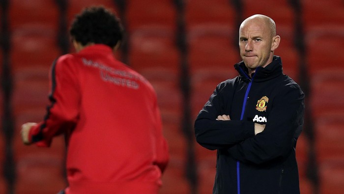 LEIGH, ENGLAND - DECEMBER 02:   Manchester United U21 Manager Nicky Butt looks on as Fabio Da Silva warms up during the Barclays U21 Premier League match between Blackburn U21 and Manchester United U21 at  Leigh Stadium on December 02, 2013 in Leigh, England.  (Photo by Jan Kruger/Getty Images)
