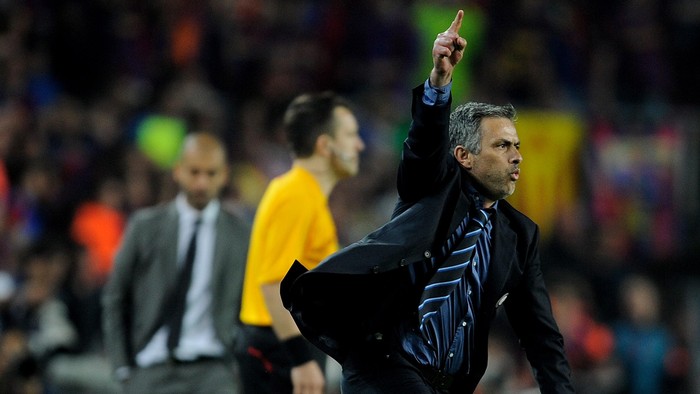 BARCELONA, SPAIN - APRIL 28: Inter Milan manager Jose Mourinho celebrates victory as barcelona manager Josep Guardiola looks on during the UEFA Champions League Semi Final Second Leg match between Barcelona and Inter Milan at Camp Nou on April 28, 2010 in Barcelona, Spain.  (Photo by Michael Regan/Getty Images)