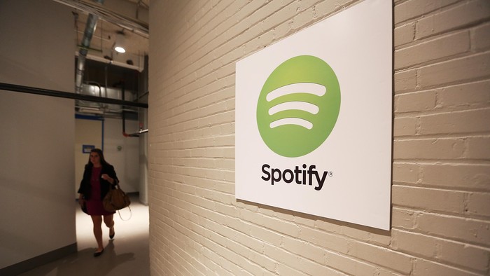 NEW YORK, NY - JUNE 27:  A woman walks through a hallway at Spotify offices following a press conference on June 27, 2013 in New York City. Spotify will add 130 tech and engineering jobs in New York and expand to a new office in the Chelsea neighborhood of Manhattan.  (Photo by Mario Tama/Getty Images)