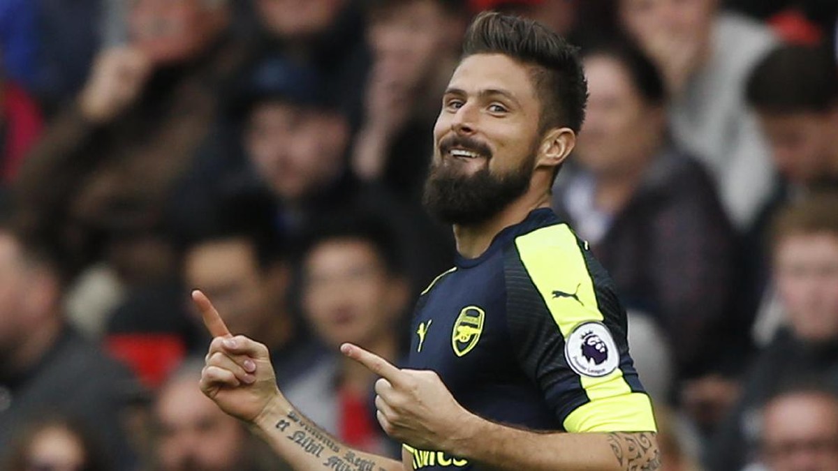 Olivier Giroud masih ingin berkostum Arsenal di musim depan. Foto: REUTERS/Russell Cheyne