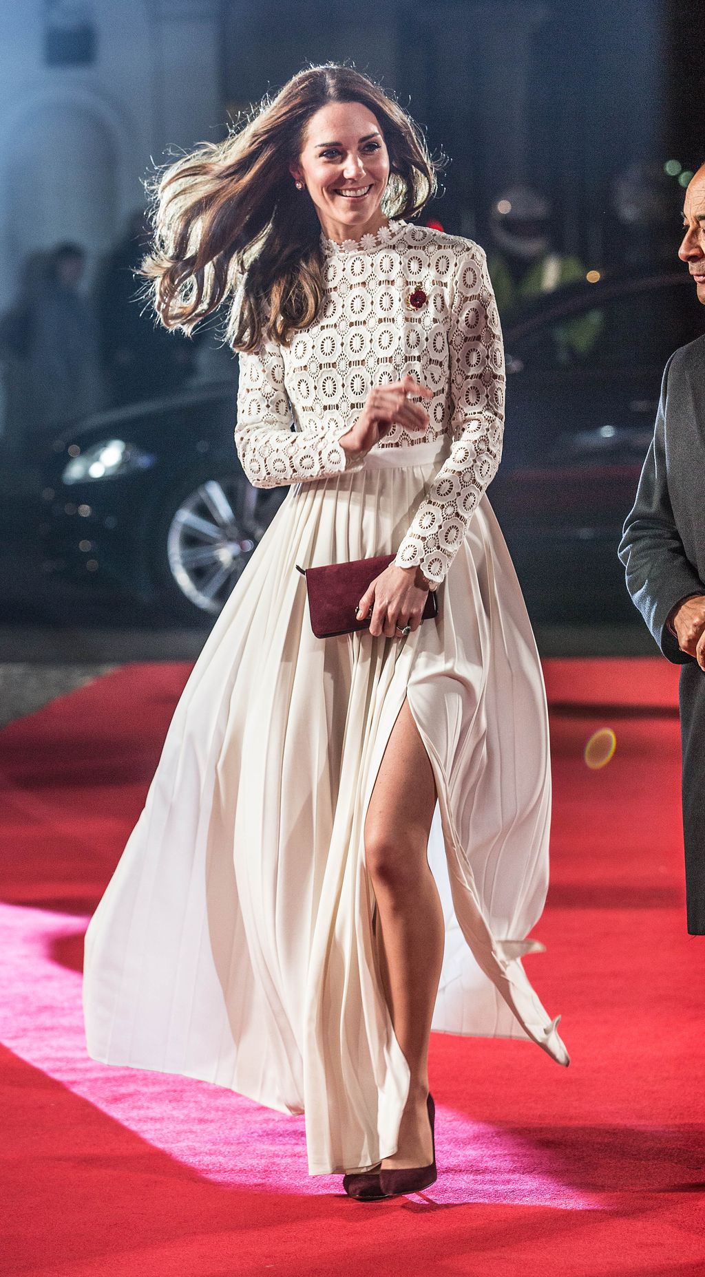 LONDON, ENGLAND - NOVEMBER 03:  Catherine, Duchess of Cambridge, Patron of Action on Addiction, greets Bob the cat as she attends the UK Premiere of 