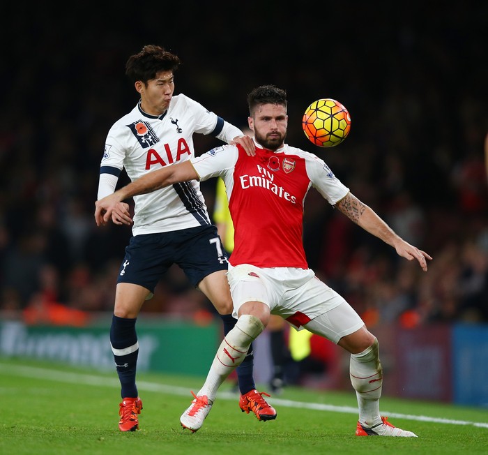  Olivier Giroud of Arsenal holds off Son Heung-Min of Spurs during the Barclays Premier League match between Arsenal and Tottenham Hotspur at the Emirates Stadium on November 8, 2015 in London, England. (Photo by Clive Rose/Getty Images)