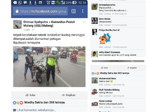 Evakuasi Kucing Mati di Jalan Raya, Polisi ini Jadi Buah Bibir Netizen