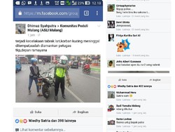 Evakuasi Kucing Mati di Jalan Raya, Polisi ini Jadi Buah Bibir Netizen