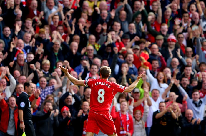 LIVERPOOL, ENGLAND - SEPTEMBER 27:  Steven Gerrard #8 of Liverpool infront of the home fans after scoring the opening goal from a free kick during the Barclays Premier League match between Liverpool and Everton at Anfield on September 27, 2014 in Liverpool, England.  (Photo by Alex Livesey/Getty Images)