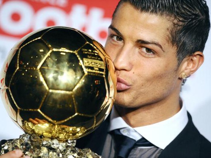 Manchester United Portuguese winger Cristiano Ronaldo poses with his trophy after he received the European footballer of the year award, the 