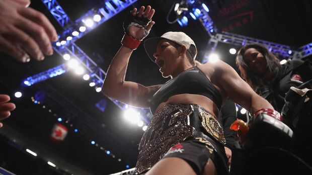 LAS VEGAS, NV - DECEMBER 30: Amanda Nunes of Brazil exits the Octagon after her victory over Ronda Rousey in their UFC women's bantamweight championship bout during the UFC 207 event on December 30, 2016 in Las Vegas, Nevada.   Christian Petersen/Getty Images/AFP