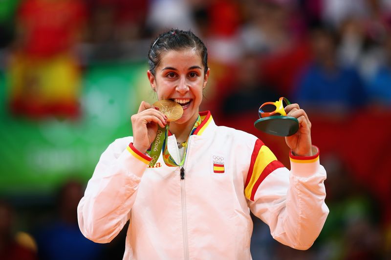 RIO DE JANEIRO, BRAZIL - AUGUST 19:  Gold medalist Carolina Marin of Spain celebrates during the medal ceremony after the Women's Singles Badminton competition on Day 14 of the Rio 2016 Olympic Games at Riocentro - Pavilion 4 on August 19, 2016 in Rio de Janeiro, Brazil.  (Photo by Clive Brunskill/Getty Images)