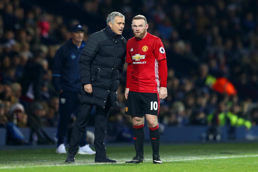 WEST BROMWICH, ENGLAND - DECEMBER 17: Jose Mourinho, Manager of Manchester United (L) speaks to Wayne Rooney of Manchester United (R) during the Premier League match between West Bromwich Albion and Manchester United at The Hawthorns on December 17, 2016 in West Bromwich, England.  (Photo by Michael Steele/Getty Images)