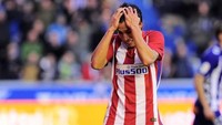 Respons pemain Atletico Nicolas Gaitan. Hasil seri membuat Atletico kini menempati posisi empat dengan 36 poin, unggul satu angka saja dari Sociedad (AFP PHOTO / ANDER GILLENEA).