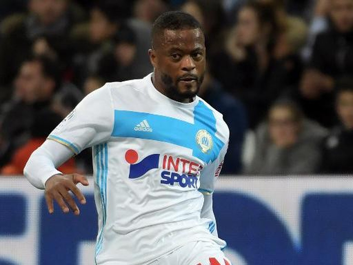 Pemain Marseille, Patrice Evra (Foto: Anne-Christine Poujoular/AFP)