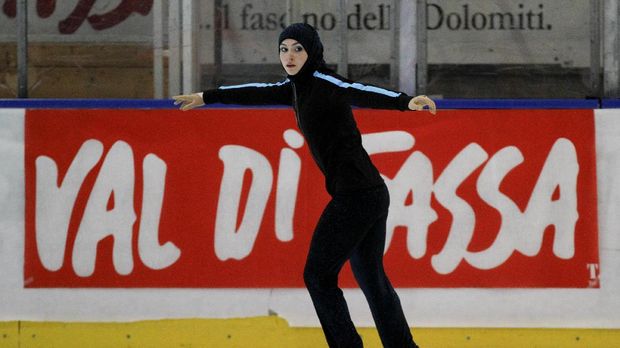 Emirati junior figure skater Zahra Lari warms up before the figure skating European Cup on April 12, 2012 in Canazei, northern Italy. 17-year-old Lari becomes the first Emirati figure skater to compete in an international competition with skaters from 50 countries taking part in the European Cup from April 9 to 13. AFP PHOTO/ANDREA SOLERO / AFP PHOTO / Andrea Solero