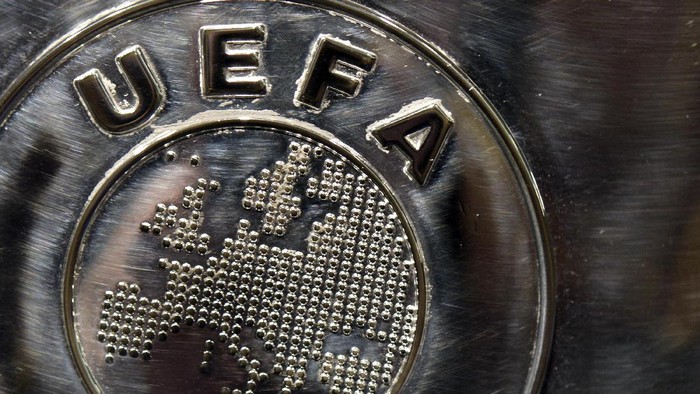 NYON, SWITZERLAND - JULY 18:  The UEFA logo is seen on the UEFA Champions League trophy as it is prepared for the UEFA 2014/15 Champions League third qualifying rounds draw at the UEFA headquarters, The House of European Football, on July 18, 2014 in Nyon, Switzerland.  (Photo by Harold Cunningham/Getty Images for UEFA)