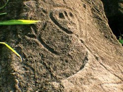 Kisah Pulau di Karibia yang Punya Batu Bergambar Wajah