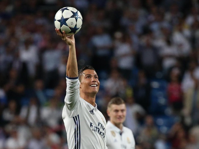 Football Soccer - Real Madrid v Bayern Munich - UEFA Champions League Quarter Final Second Leg - Estadio Santiago Bernabeu, Madrid, Spain - 18/4/17 Real Madrid's Cristiano Ronaldo celebrates after the game with the match ball after scoring a hat trick Reuters / Sergio Perez Livepic