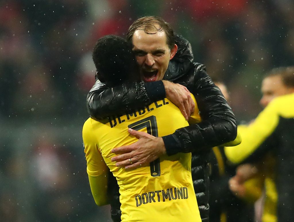 Soccer Football - Bayern Munich v Borussia Dortmund - DFB Pokal Semi Final - Allianz Arena, Munich, Germany - 26/4/17 Borussia Dortmund coach Thomas Tuchel and Ousmane Dembele celebrate after the match Reuters / Michael Dalder Livepic DFL RULES TO LIMIT THE ONLINE USAGE DURING MATCH TIME TO 15 PICTURES PER GAME. IMAGE SEQUENCES TO SIMULATE VIDEO IS NOT ALLOWED AT ANY TIME. FOR FURTHER QUERIES PLEASE CONTACT DFL DIRECTLY AT + 49 69 650050      DFB RULES PROHIBIT USE IN MMS SERVICES VIA HANDHELD DEVICES UNTIL TWO HOURS AFTER A MATCH AND ANY USAGE ON INTERNET OR ONLINE MEDIA SIMULATING VIDEO FOOTAGE DURING THE MATCH.