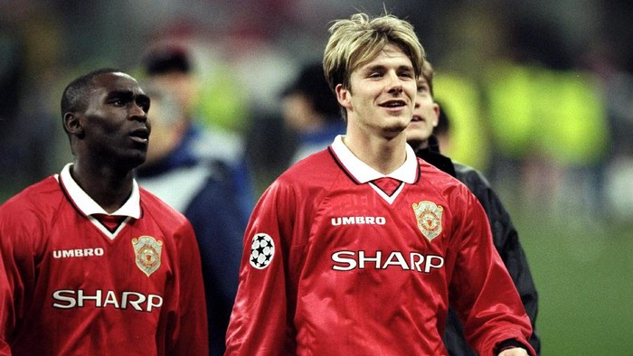 17 Mar 1999:  David Beckham and Andy Cole of Manchester United walk off the pitch after the UEFA Champions League quarter-final second leg match against Inter Milan at the San Siro in Milan, Italy. United went through 3-1 on aggregate after a 1-1 draw onthe night.   Mandatory Credit: Stu Forster /Allsport