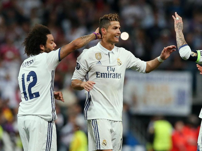 Football Soccer - Real Madrid v Atletico Madrid - UEFA Champions League Semi Final First Leg - Estadio Santiago Bernabeu, Madrid, Spain - 2/5/17 Real Madrid's Cristiano Ronaldo and Sergio Ramos celebrate after the match with Marcelo  Reuters / Albert Gea Livepic