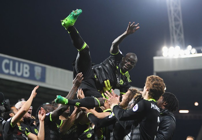 WEST BROMWICH, ENGLAND - MAY 12:  NGolo Kante of Chelsea is chucked in the air by team mates while celebrating winning the leauge title after the Premier League match between West Bromwich Albion and Chelsea at The Hawthorns on May 12, 2017 in West Bromwich, England.  (Photo by Laurence Griffiths/Getty Images)