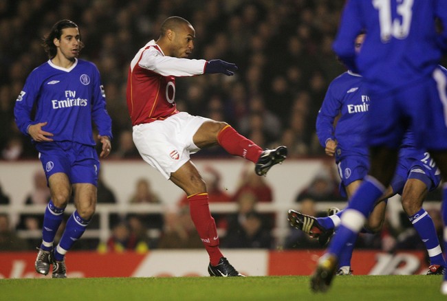 LONDON- ENGLAND - DECEMBER 12:  Thierry Henry of Arsenal scores their first goal during the Barclays Premiership match between Arsenal and Chelsea  at Highbury on December 12, 2004 in London, England. (Photo by Ben Radford/Getty Images)