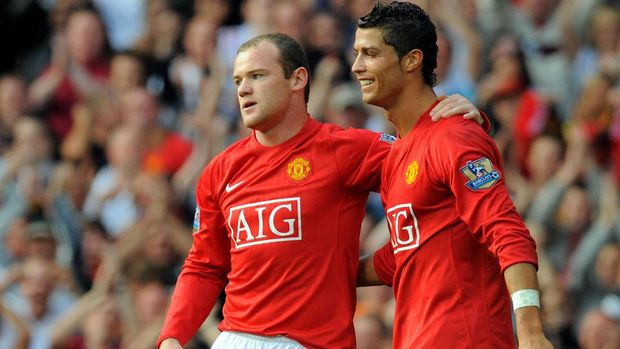 Manchester United's English forward Wayne Rooney (L) celebrates after scoring with Manchester United's Portugese midfielder Cristiano Ronaldo during the English Premier league football match against Bolton Wanderers at Old Trafford, Manchester, northwest England, on September 27 2008. AFP PHOTO/ANDREW YATESMobile and website use of domestic English football pictures are subject to obtaining a Photographic End User Licence from Football DataCo Ltd Tel : +44 (0) 207 864 9121 or e-mail accreditations@football-dataco.com - applies to Premier and Football League matches. / AFP PHOTO / ANDREW YATES
