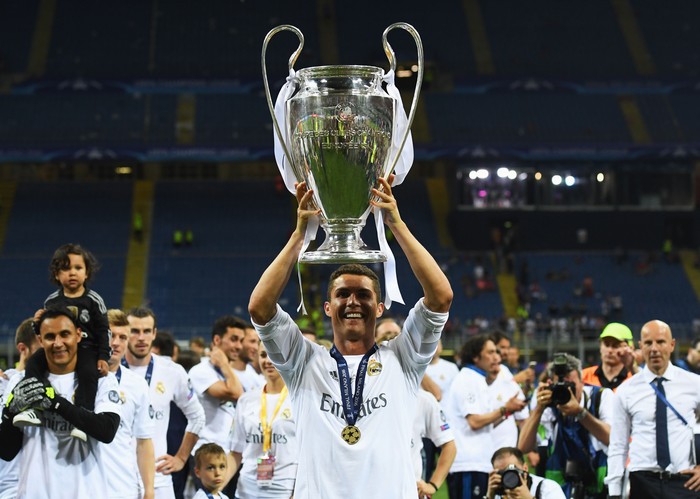 MILAN, ITALY - MAY 28:  Cristiano Ronaldo of Real Madrid celebrates with the Champions League trophy after the UEFA Champions League Final match between Real Madrid and Club Atletico de Madrid at Stadio Giuseppe Meazza on May 28, 2016 in Milan, Italy.  (Photo by Matthias Hangst/Getty Images)